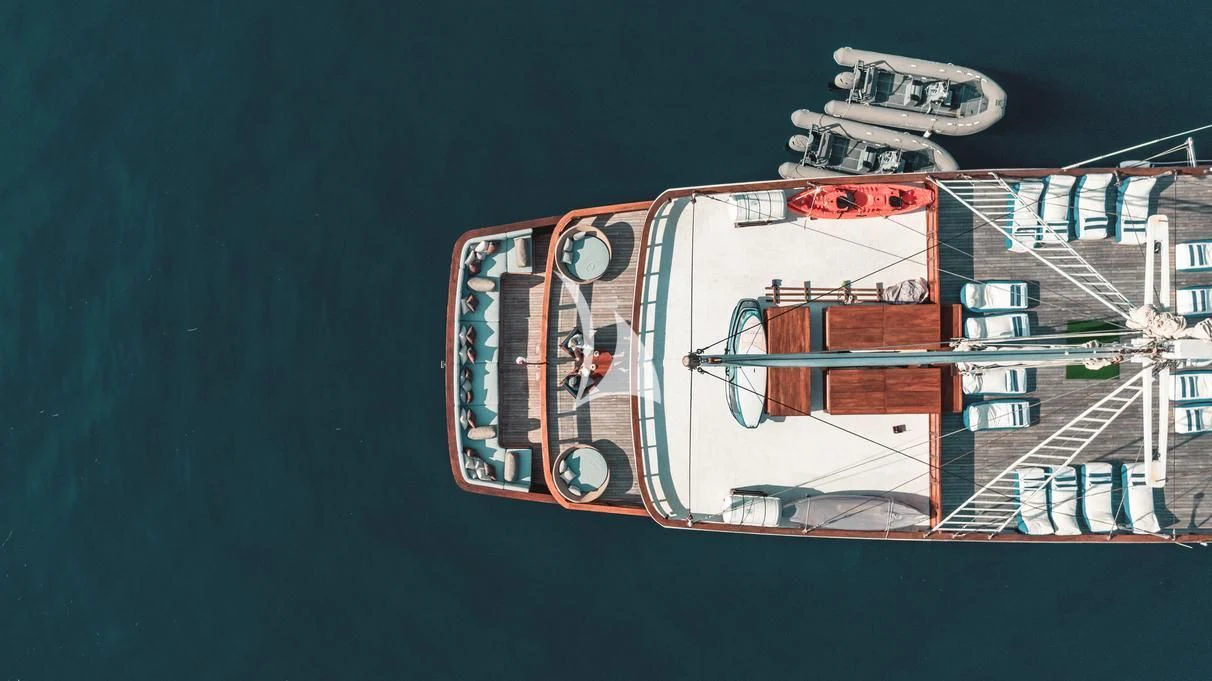 a red and white truck aboard THE MAJ OCEANIC Yacht for Charter