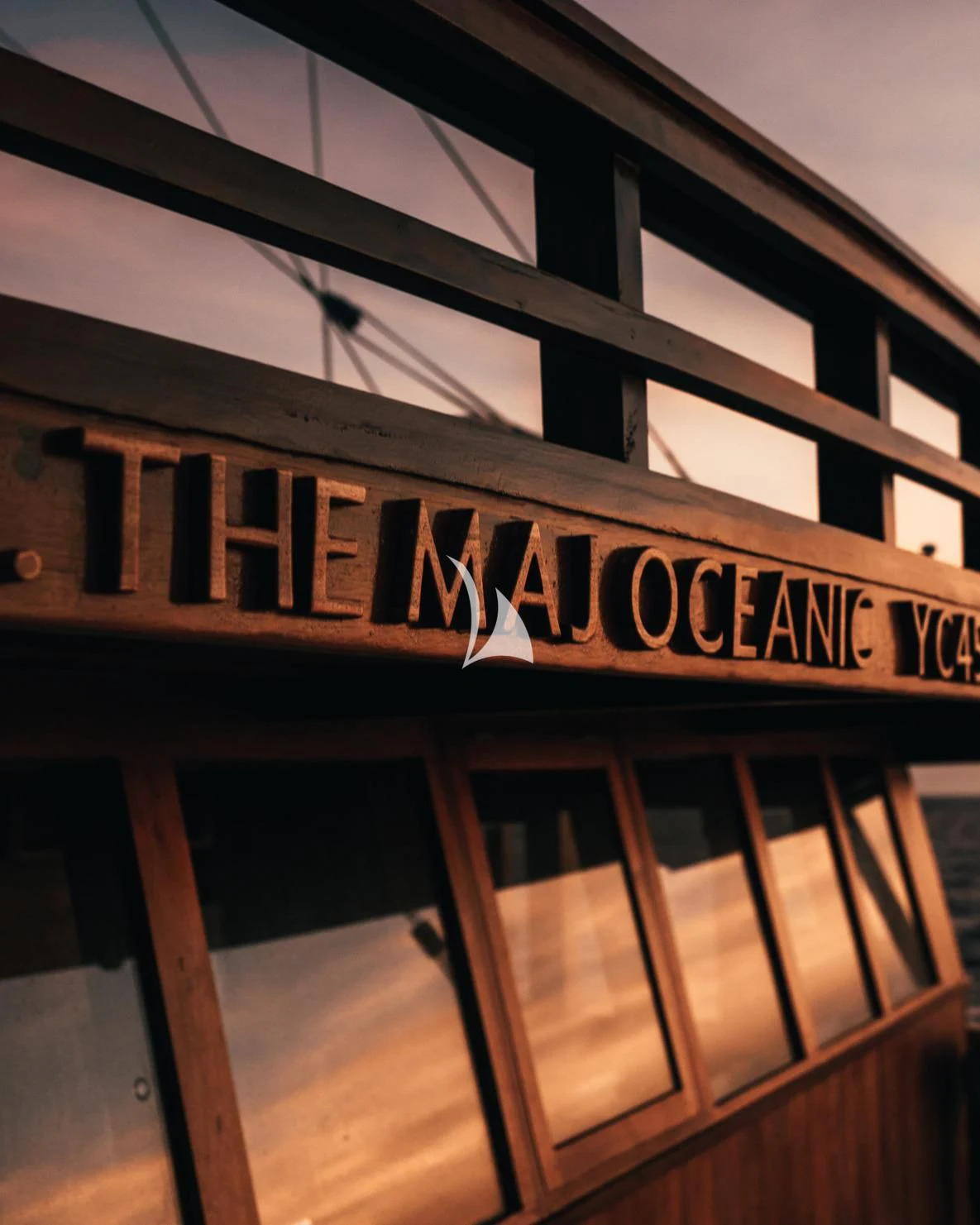 a sign on a building aboard THE MAJ OCEANIC Yacht for Charter