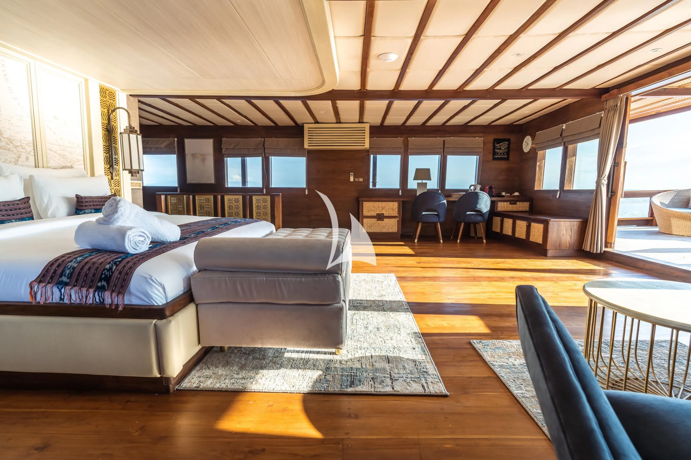 a large bedroom with a large bed aboard THE MAJ OCEANIC Yacht for Charter