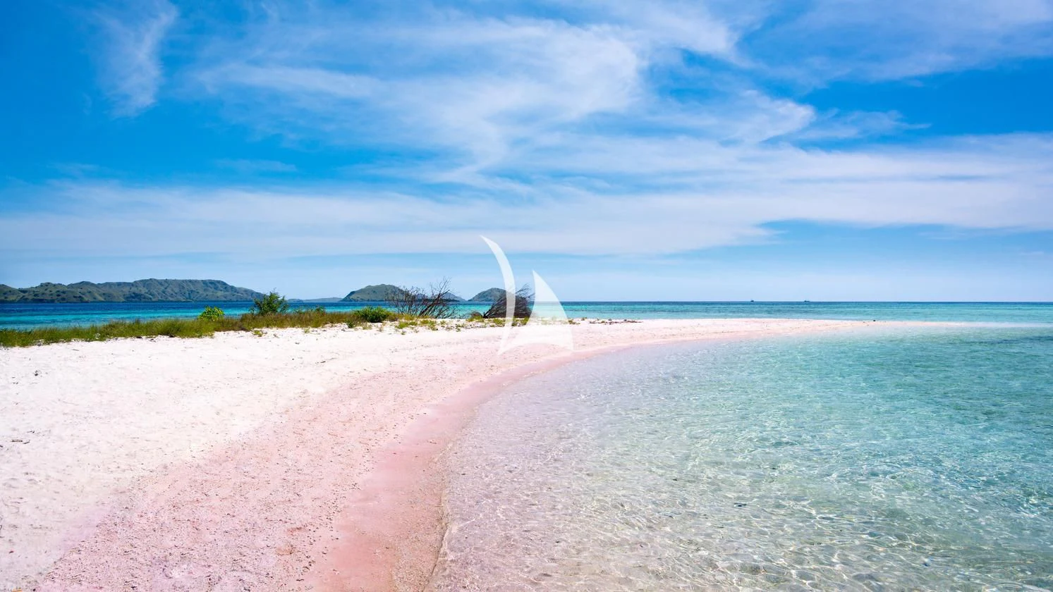 a sandy beach with a white cone shaped object in the middle aboard THE MAJ OCEANIC Yacht for Charter