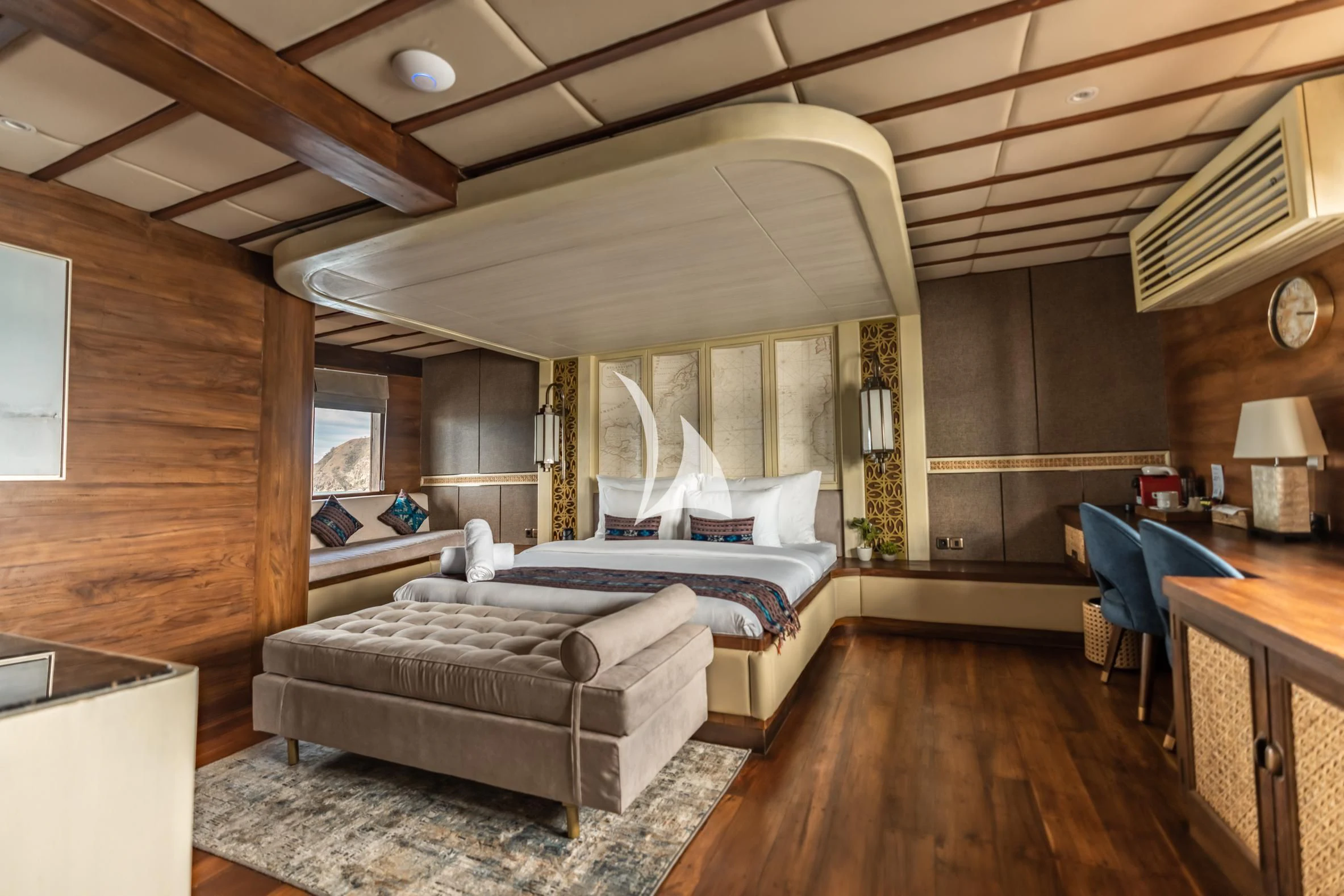 a large bedroom with a large bed aboard THE MAJ OCEANIC Yacht for Charter