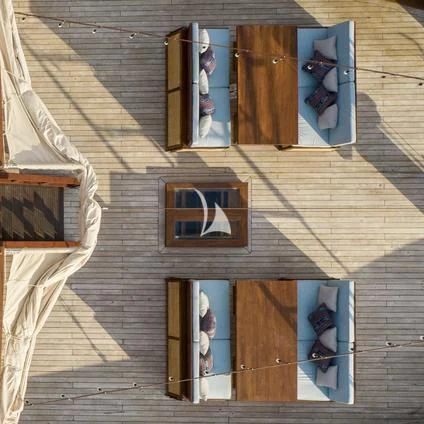 a couple of people standing on a building with a sign on the door aboard THE MAJ OCEANIC Yacht for Charter