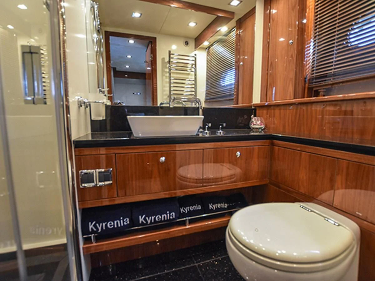 a bathroom with a tub sink and toilet aboard KYRENIA Yacht for Sale