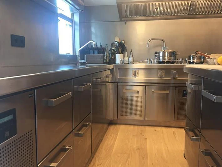 a kitchen with stainless steel appliances aboard VIKA Yacht for Sale