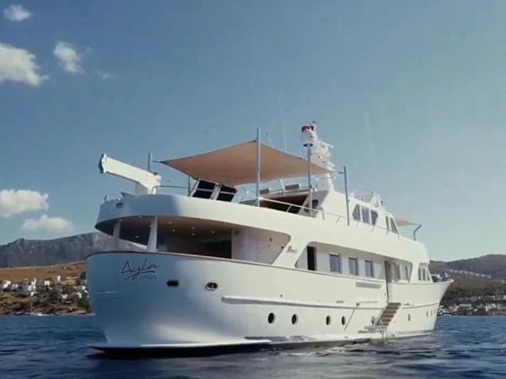 a white yacht on the water aboard VIKA Yacht for Sale
