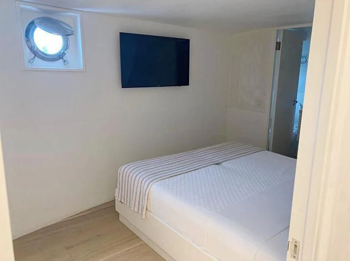a bed in a room aboard VIKA Yacht for Sale