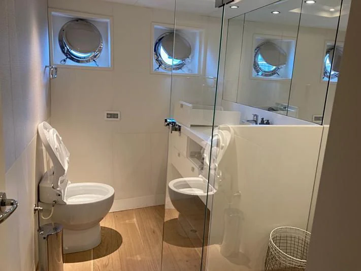 a bathroom with a glass shower aboard VIKA Yacht for Sale