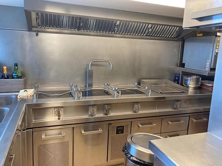 a kitchen with a sink and a dishwasher aboard VIKA Yacht for Sale