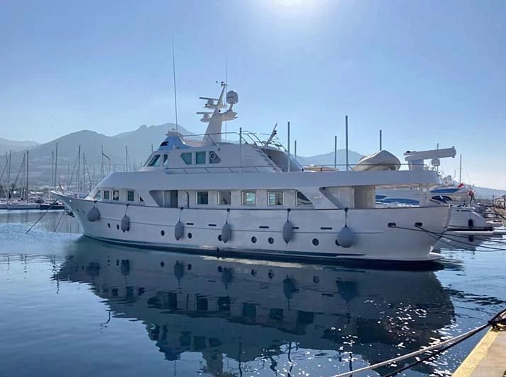 a white boat on water aboard VIKA Yacht for Sale