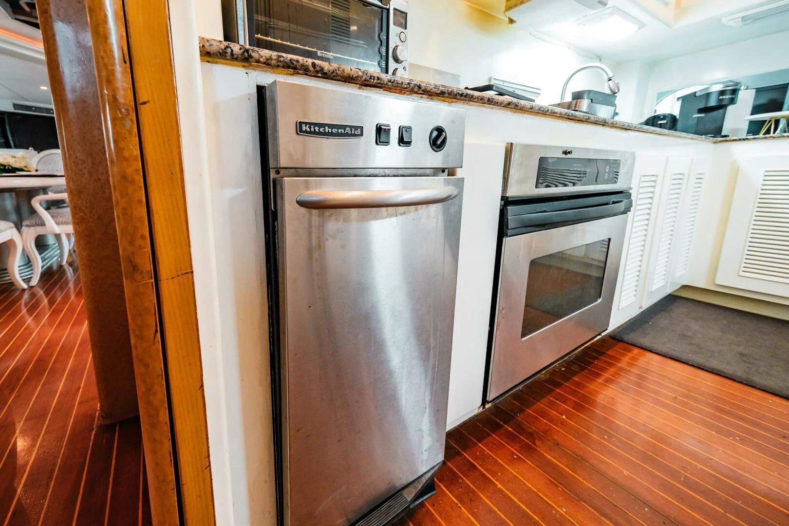a kitchen with a stainless steel oven aboard LADY GERTS Yacht for Sale