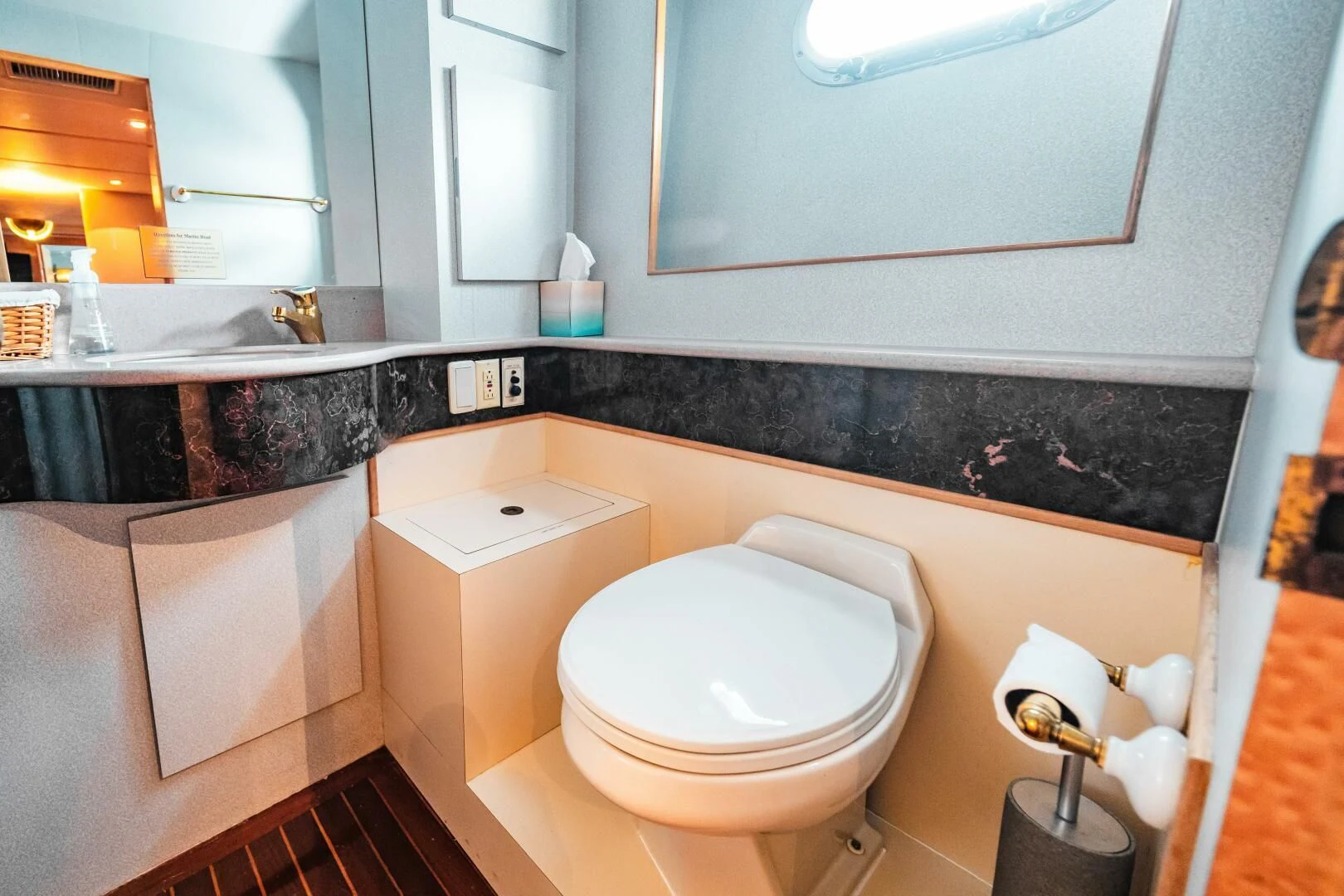 a bathroom with a toilet and bathtub aboard LADY GERTS Yacht for Sale