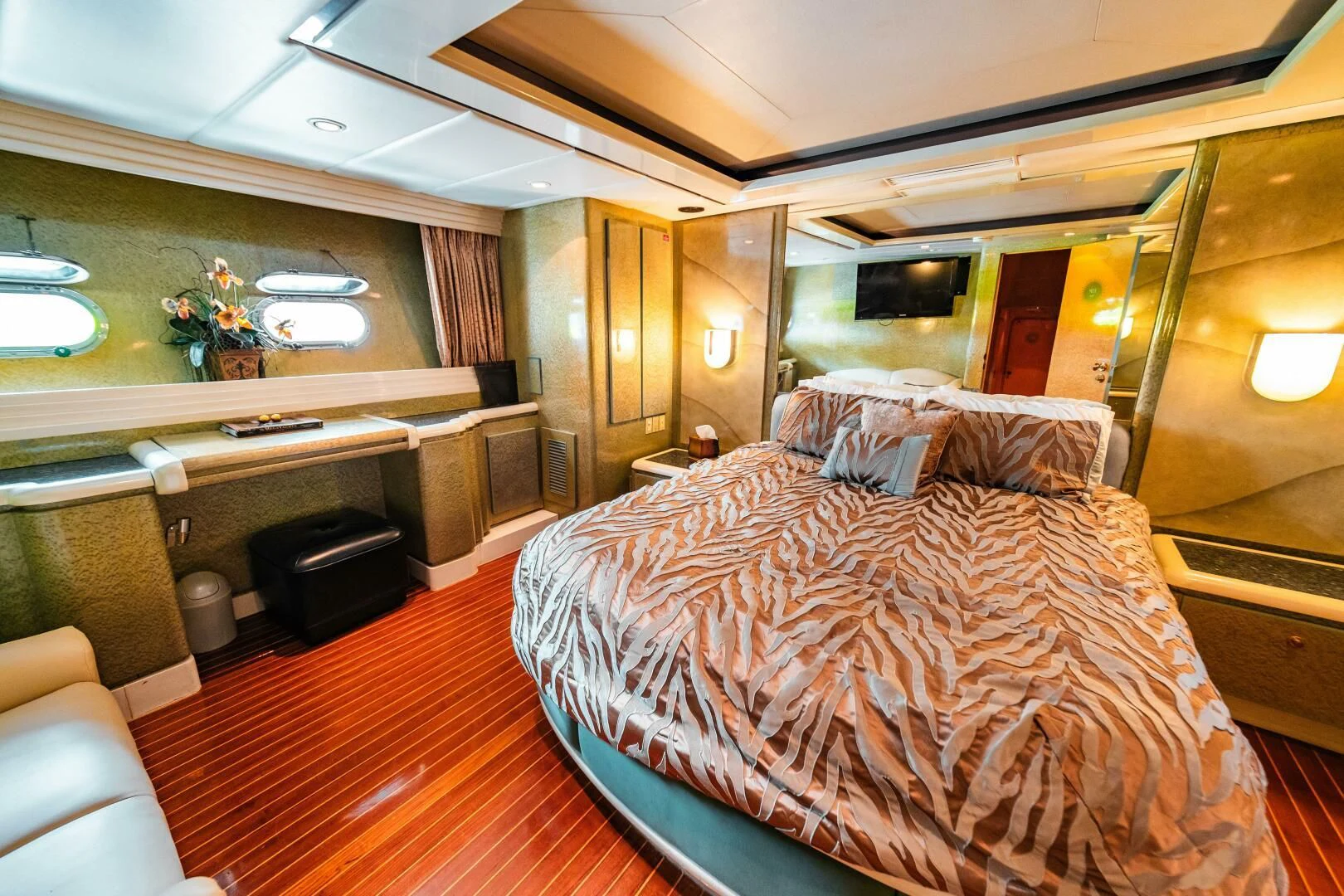 a bedroom with a bed and a desk aboard LADY GERTS Yacht for Sale