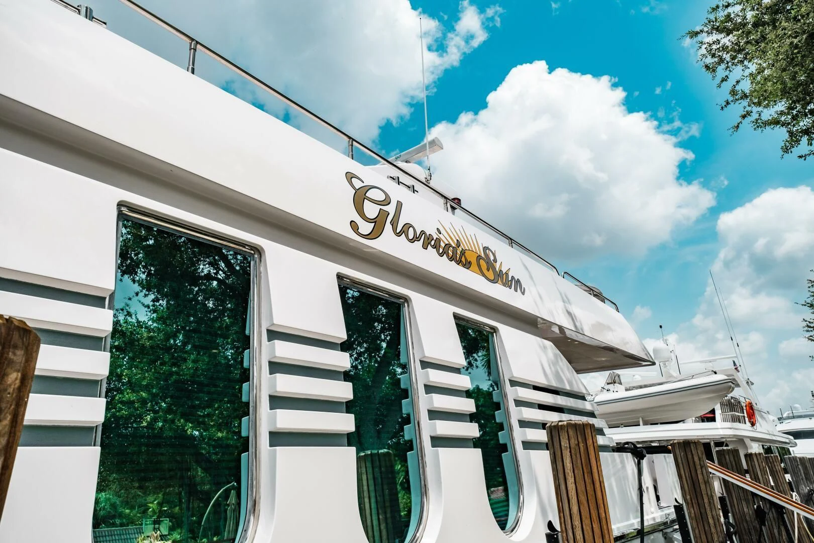 a white building with a sign aboard LADY GERTS Yacht for Sale