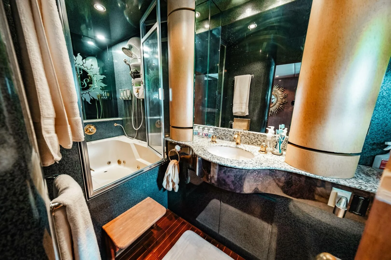 a bathroom with a large mirror aboard LADY GERTS Yacht for Sale