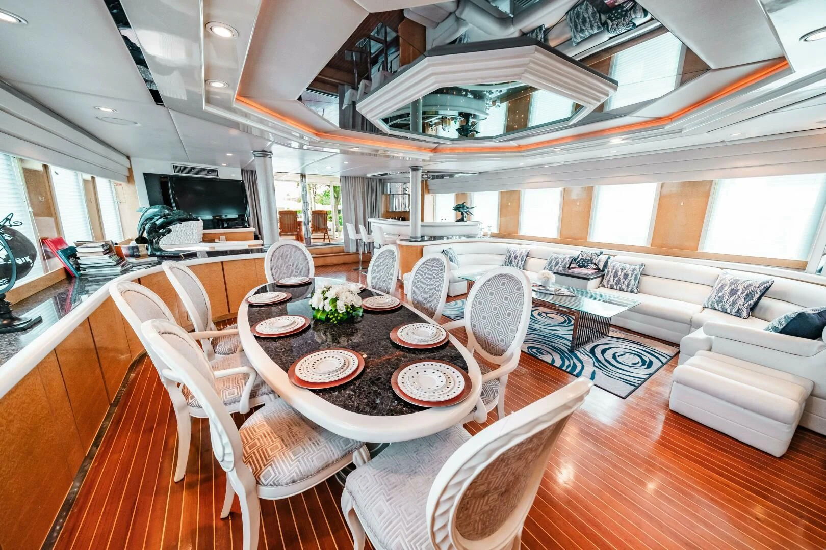 a living room with a table and chairs aboard LADY GERTS Yacht for Sale