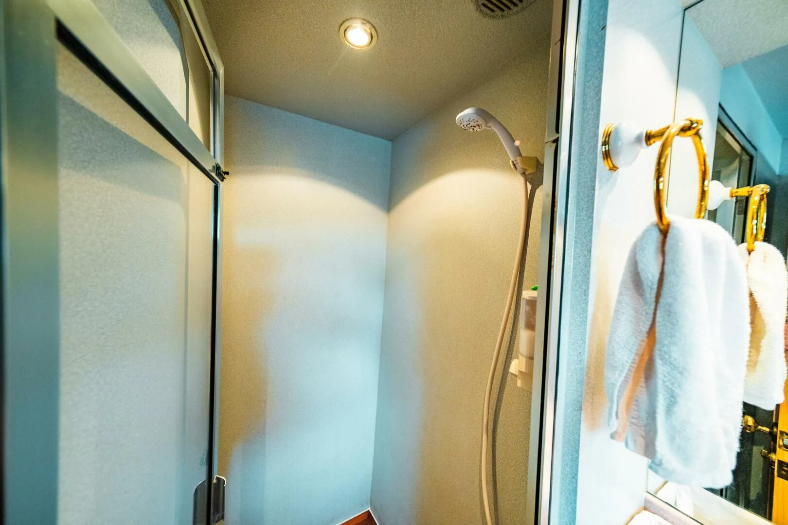 a bathroom with a shower and a sink aboard LADY GERTS Yacht for Sale