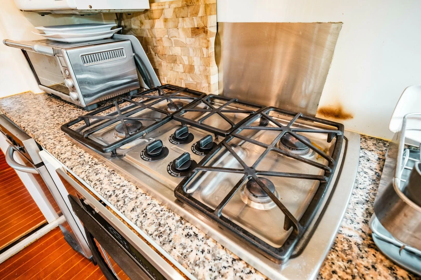 a kitchen with a stove and oven aboard LADY GERTS Yacht for Sale