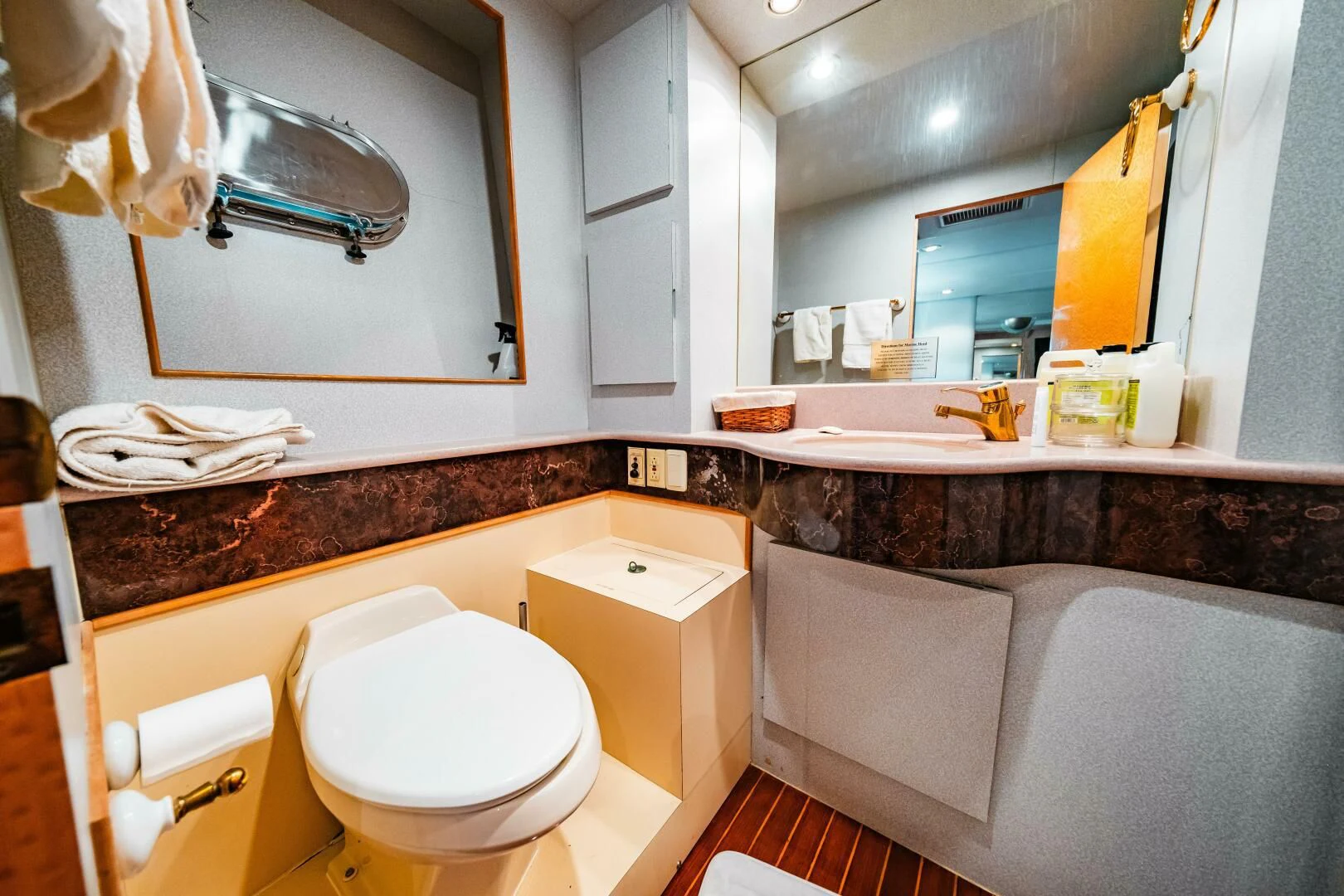 a bathroom with a large mirror aboard LADY GERTS Yacht for Sale
