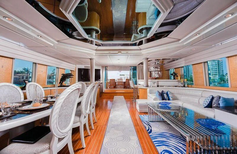 a large room with a table and chairs aboard LADY GERTS Yacht for Sale