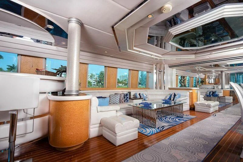 a large room with a large fireplace aboard LADY GERTS Yacht for Sale