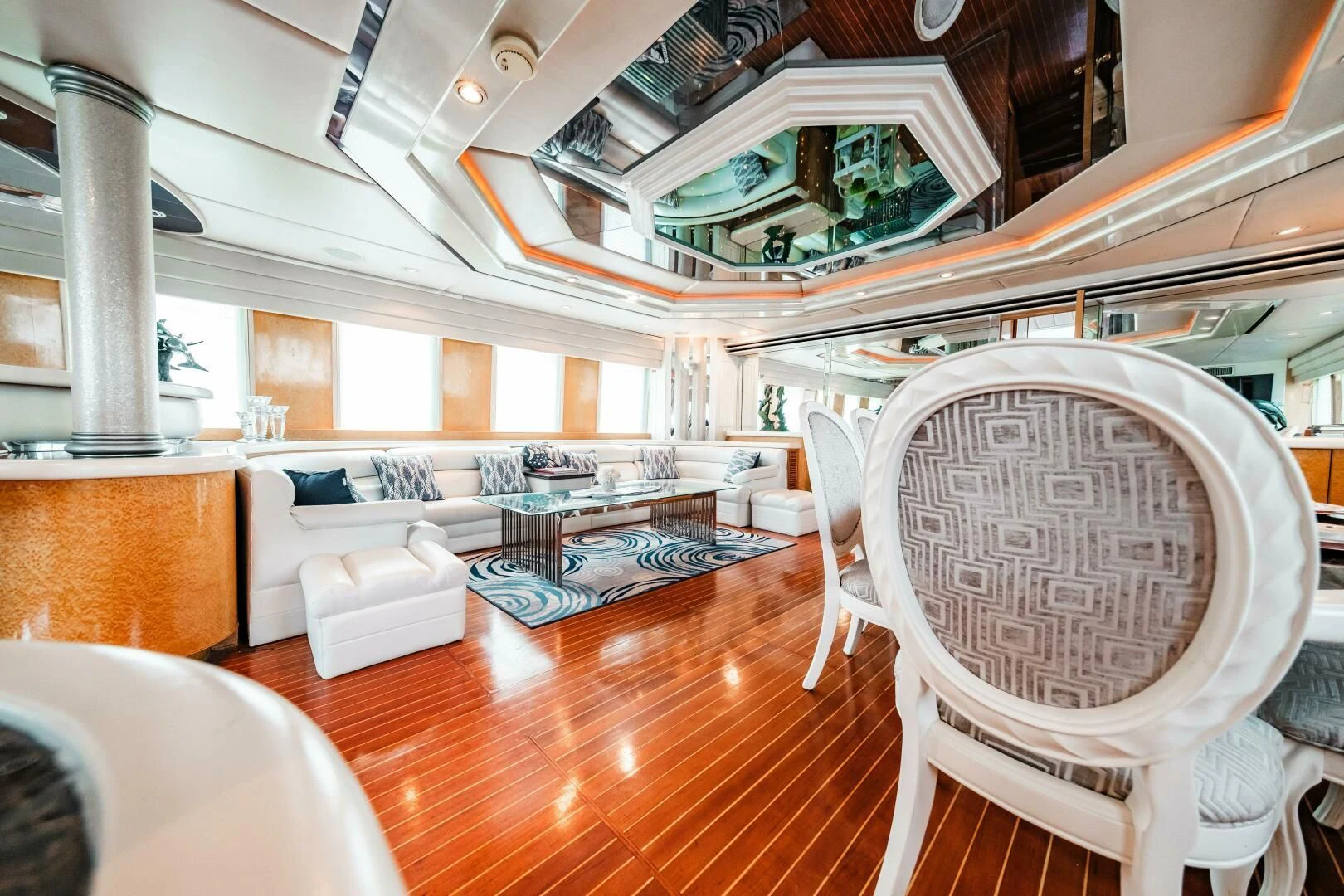a room with a couch and chairs aboard LADY GERTS Yacht for Sale