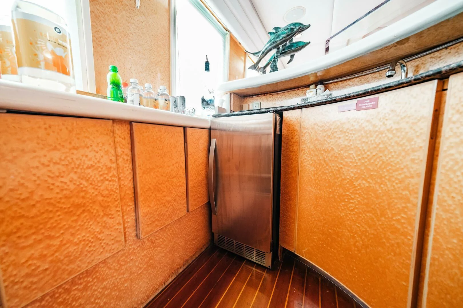 a kitchen with wooden cabinets aboard LADY GERTS Yacht for Sale