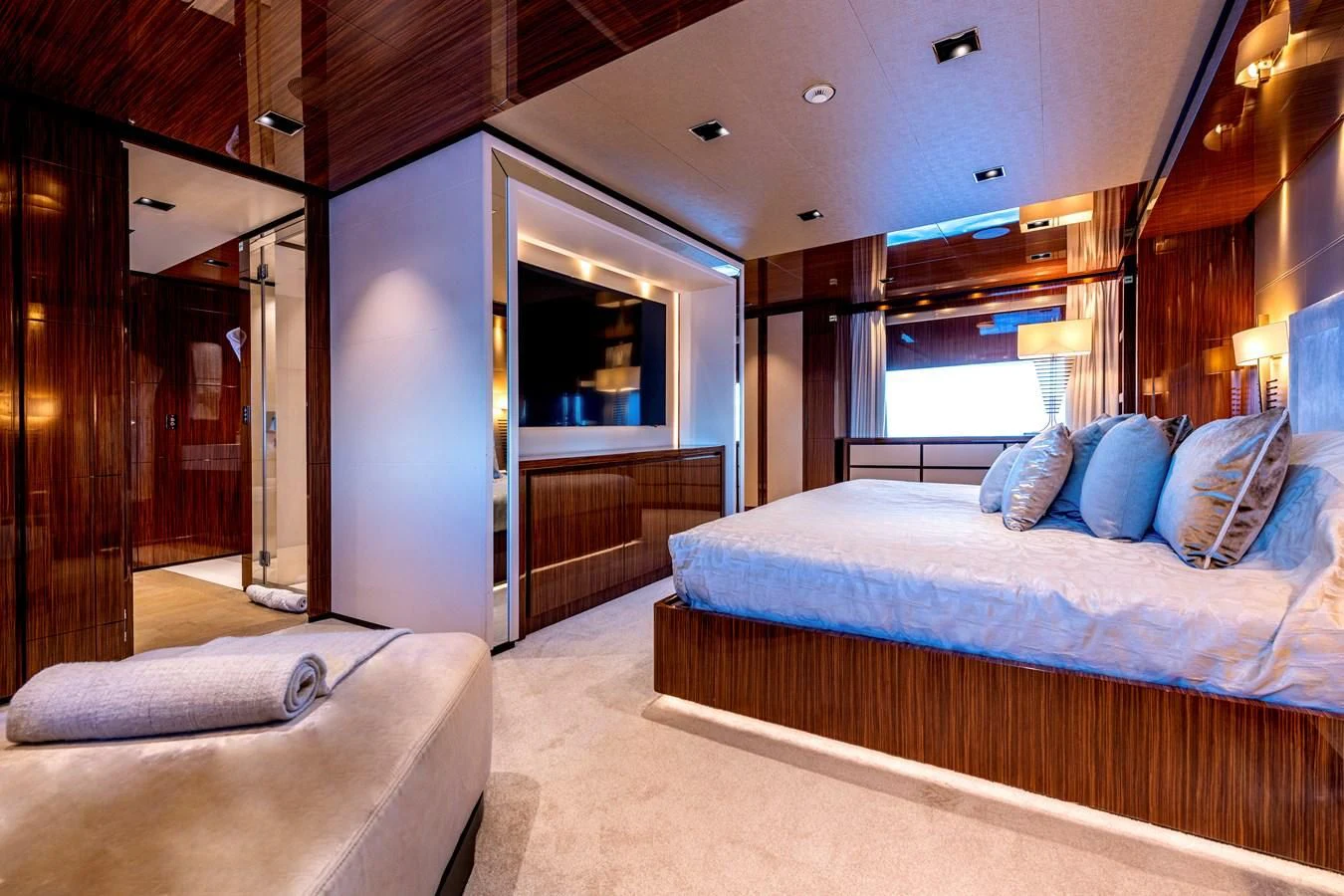 a bedroom with a bed and a door aboard MEDIALLY Yacht for Sale