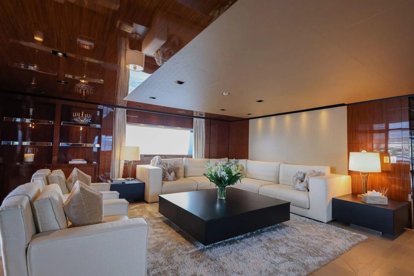 a living room with a large window aboard MEDIALLY Yacht for Sale