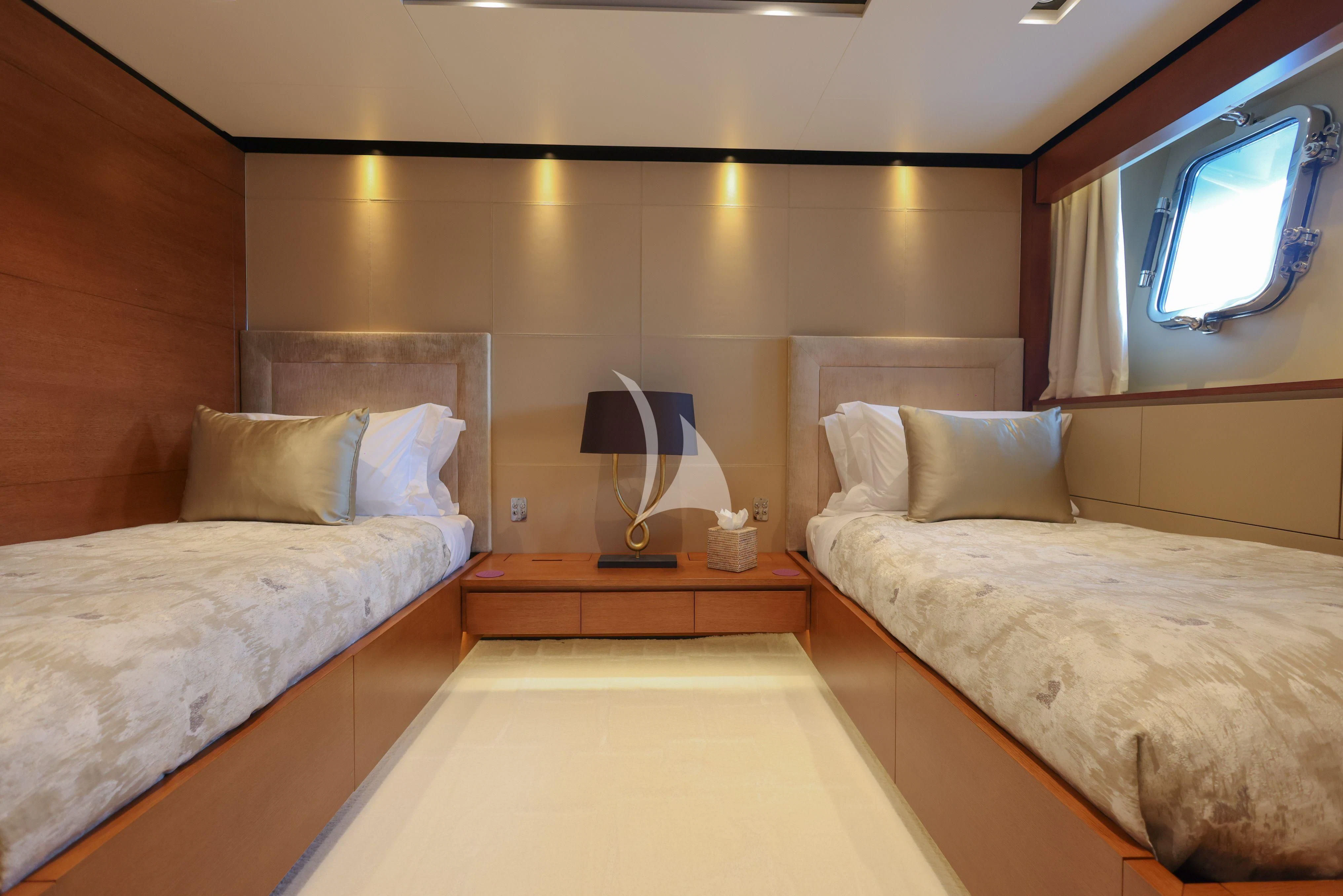a room with two beds aboard MEDIALLY Yacht for Sale
