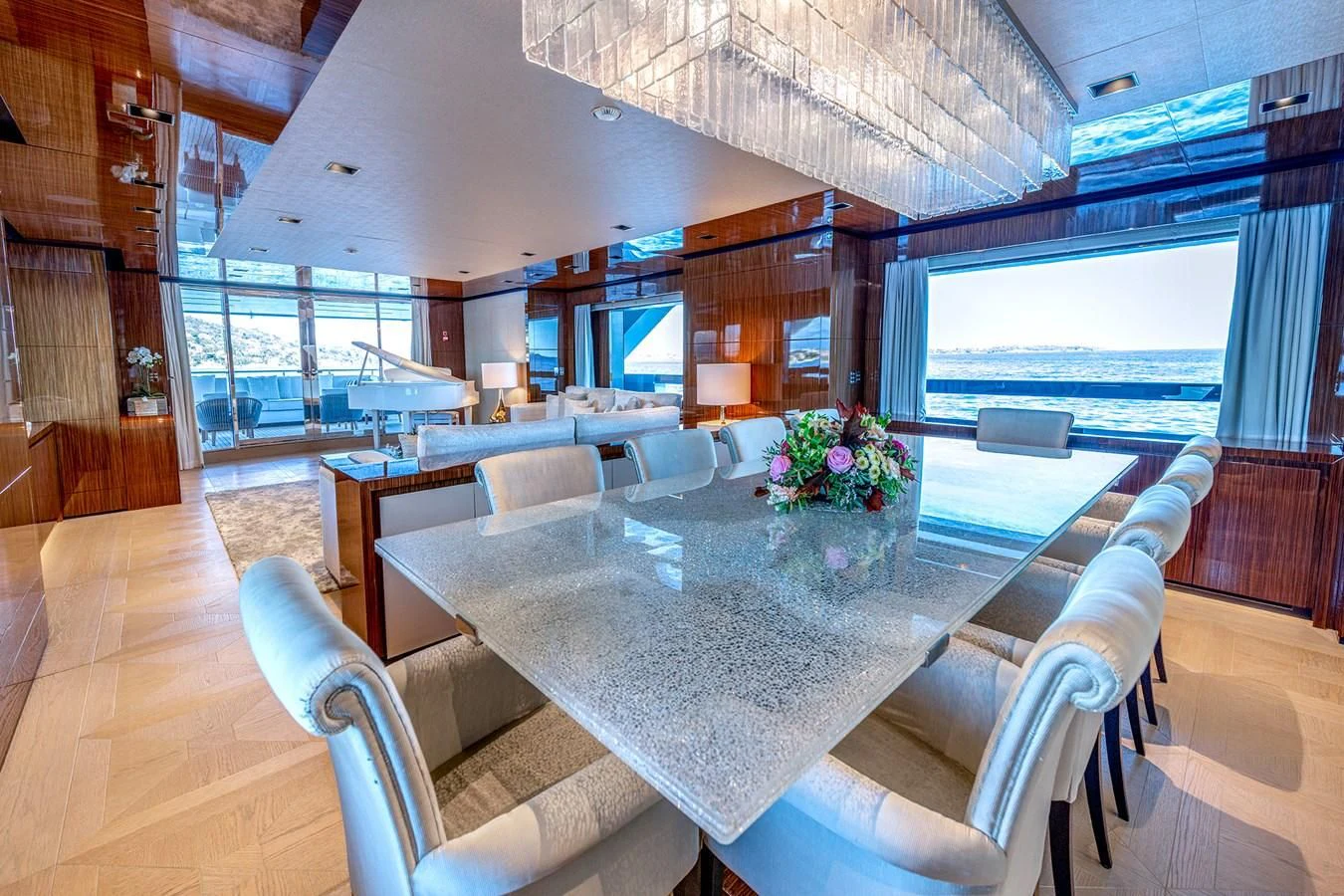 a large room with a table and chairs aboard MEDIALLY Yacht for Sale