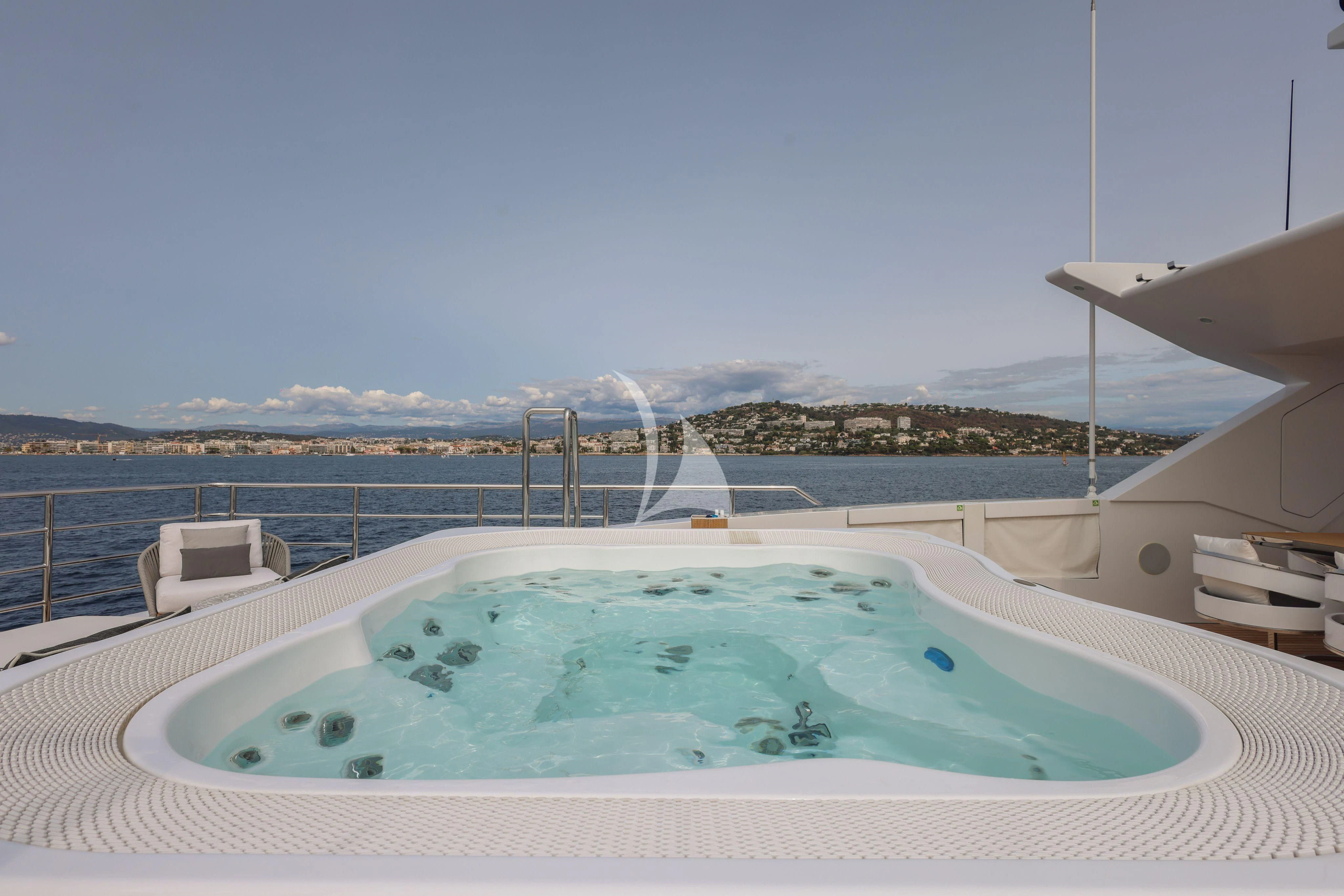 a large swimming pool aboard MEDIALLY Yacht for Sale