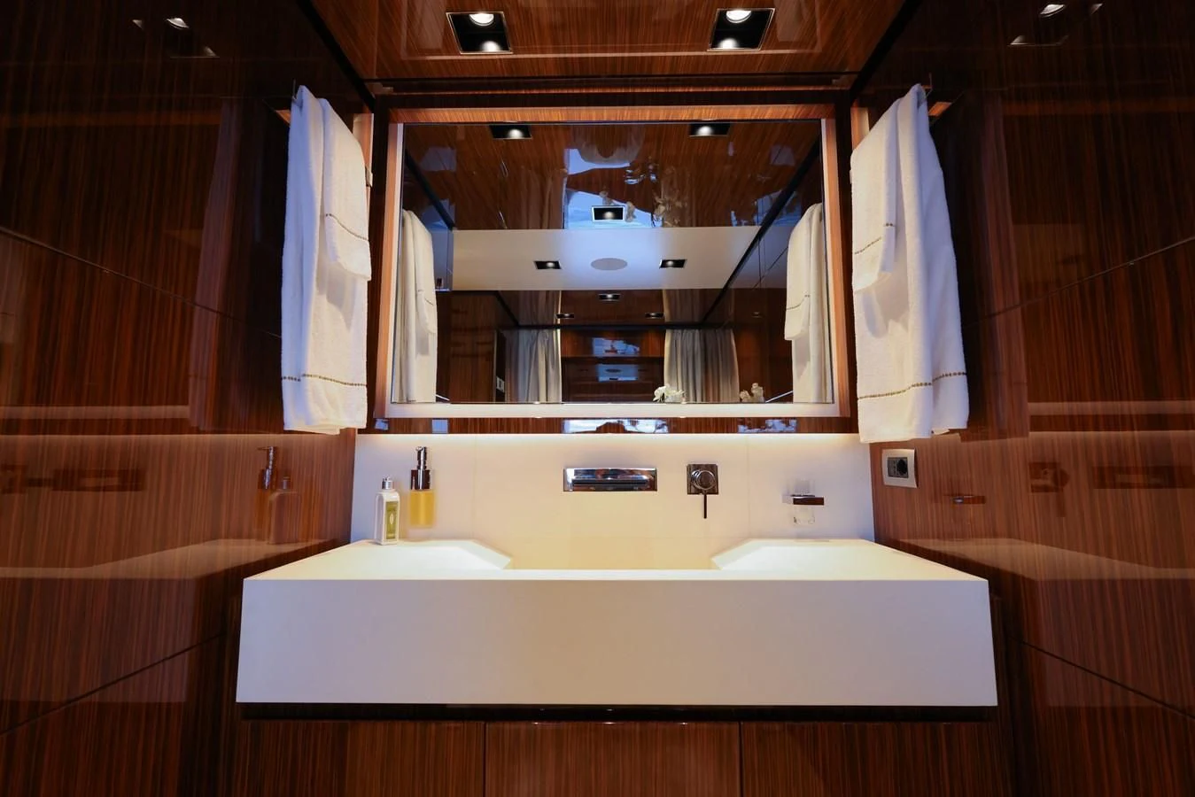 a bathroom with a large mirror aboard MEDIALLY Yacht for Sale