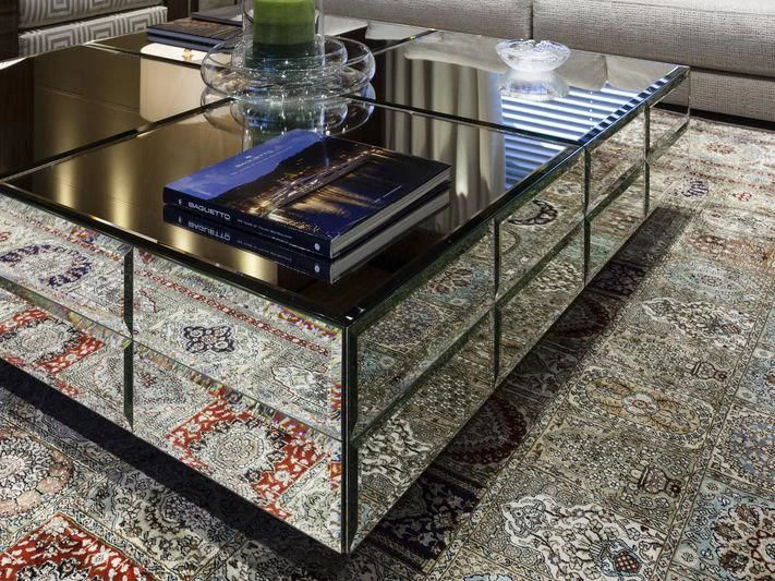 a glass table with a blue tablecloth and a glass vase on top aboard MEDIALLY Yacht for Sale