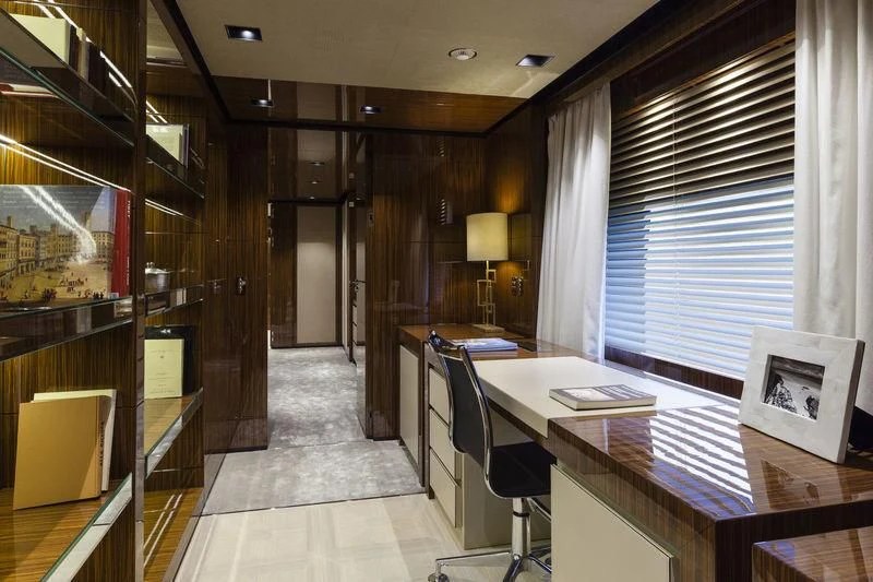 a room with a table and chairs aboard MEDIALLY Yacht for Sale