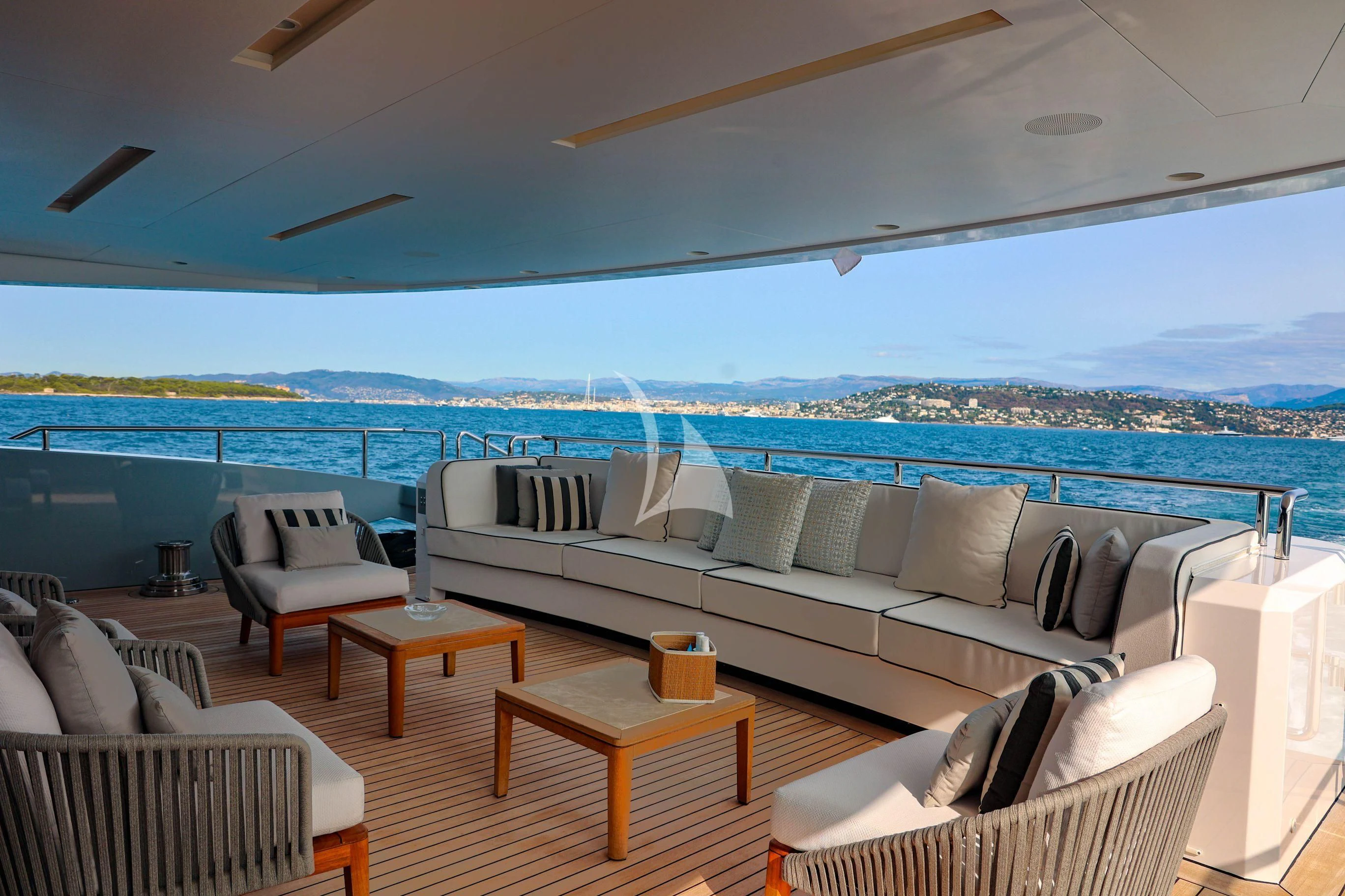 a living room with a large balcony aboard MEDIALLY Yacht for Sale