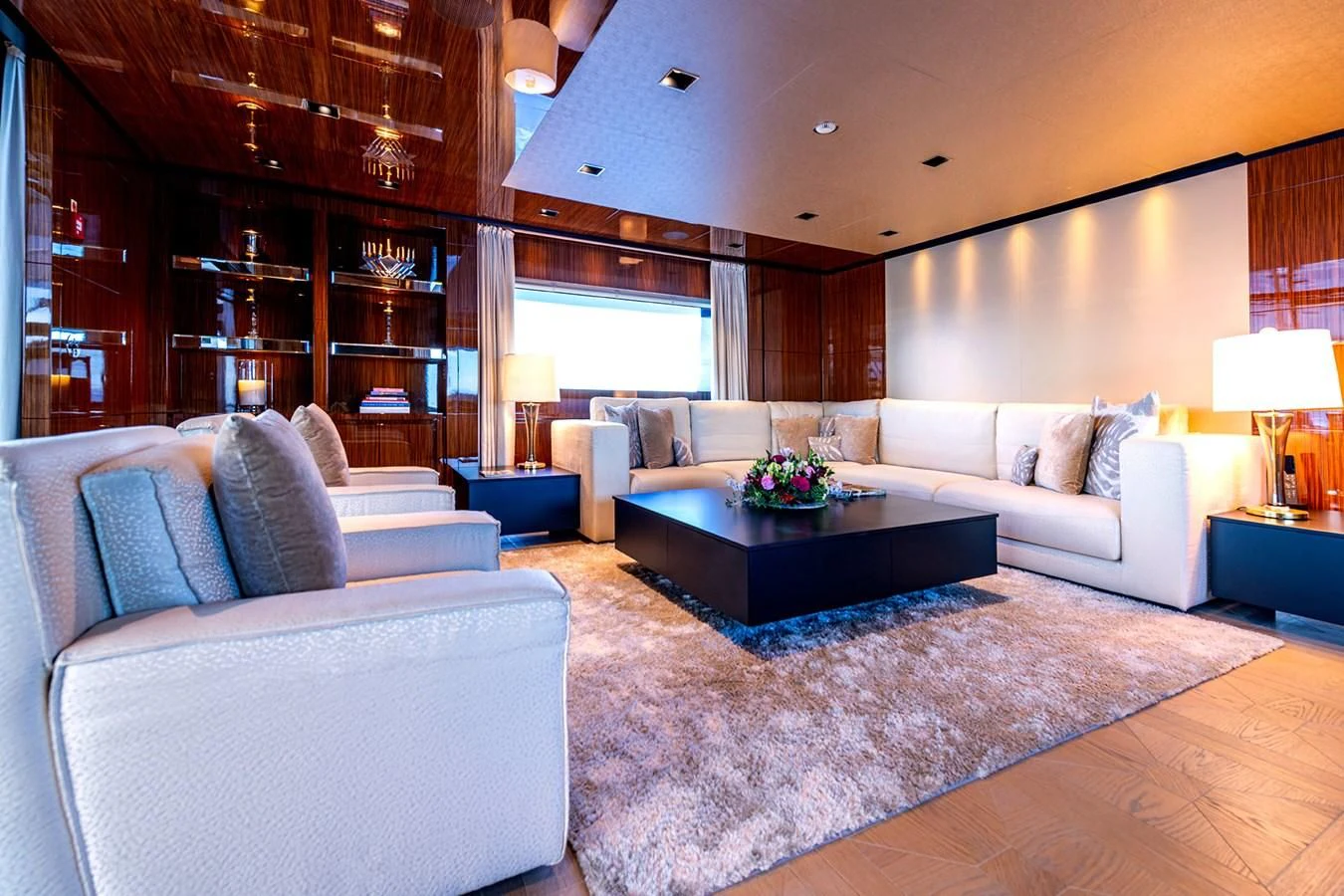 a living room with a large sofa aboard MEDIALLY Yacht for Sale