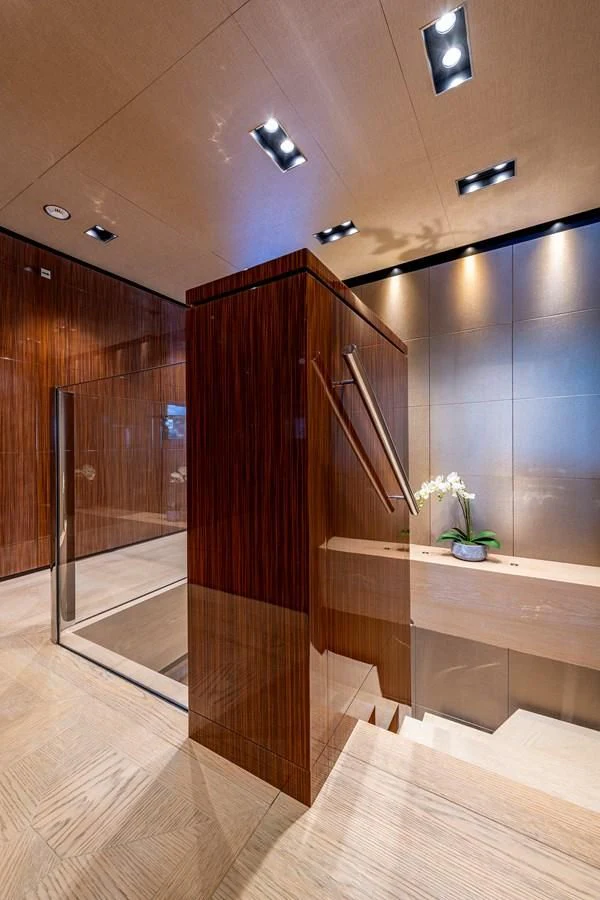 a room with a wood floor and a wood door aboard MEDIALLY Yacht for Sale