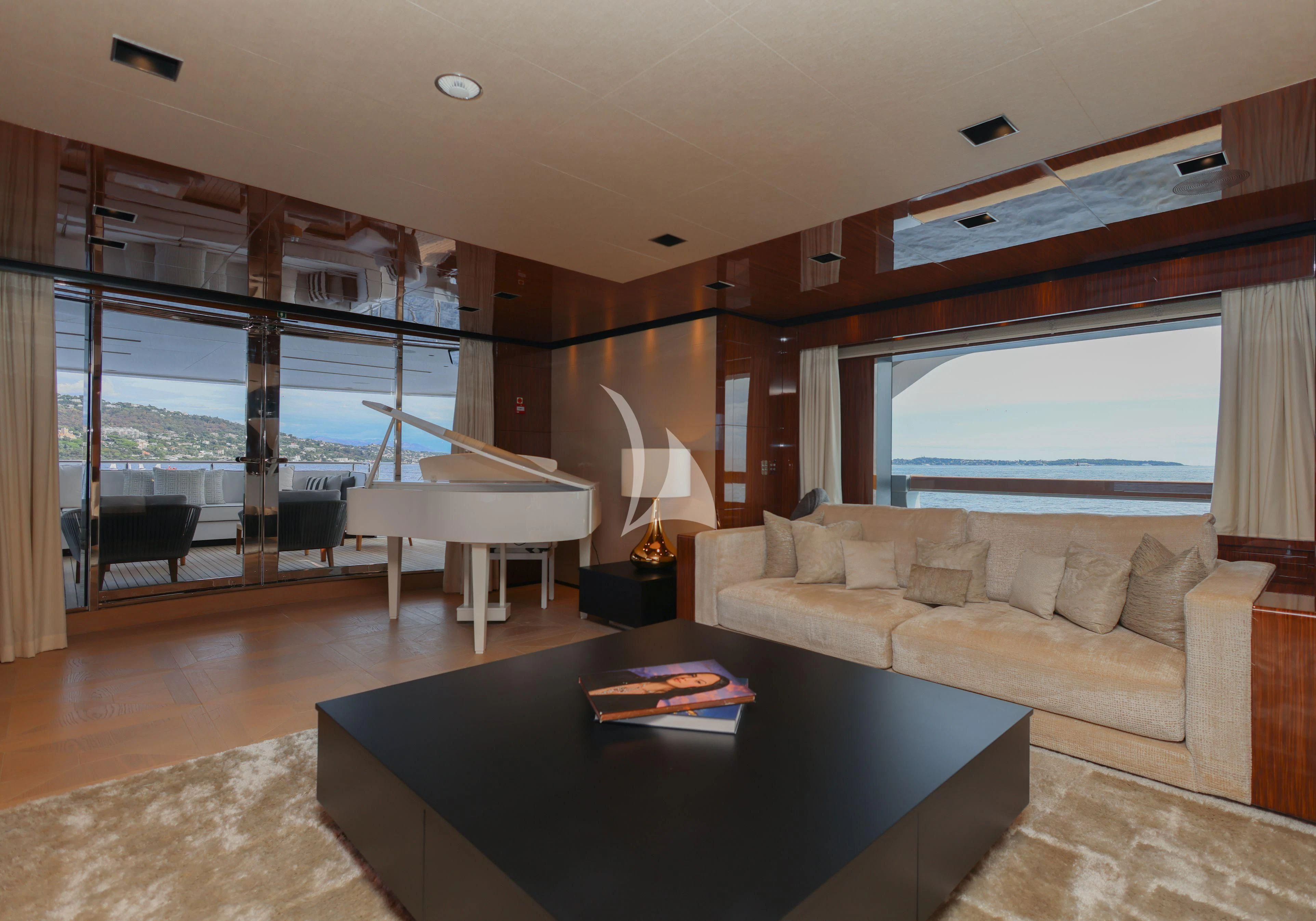 a living room with a large window aboard MEDIALLY Yacht for Sale