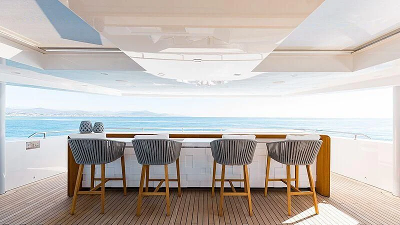 a group of chairs on a deck aboard MEDIALLY Yacht for Sale