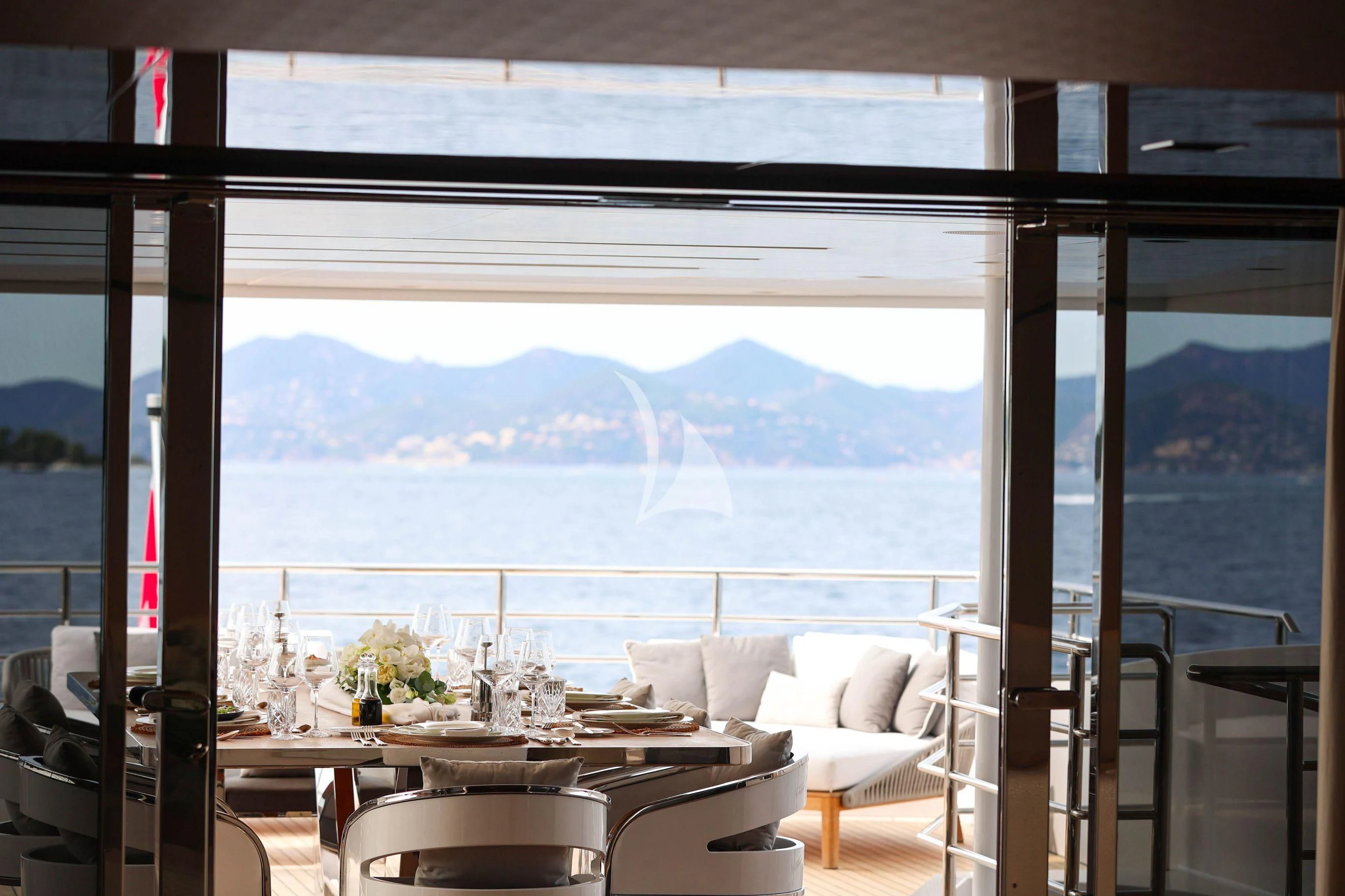 a room with a table and chairs aboard MEDIALLY Yacht for Sale