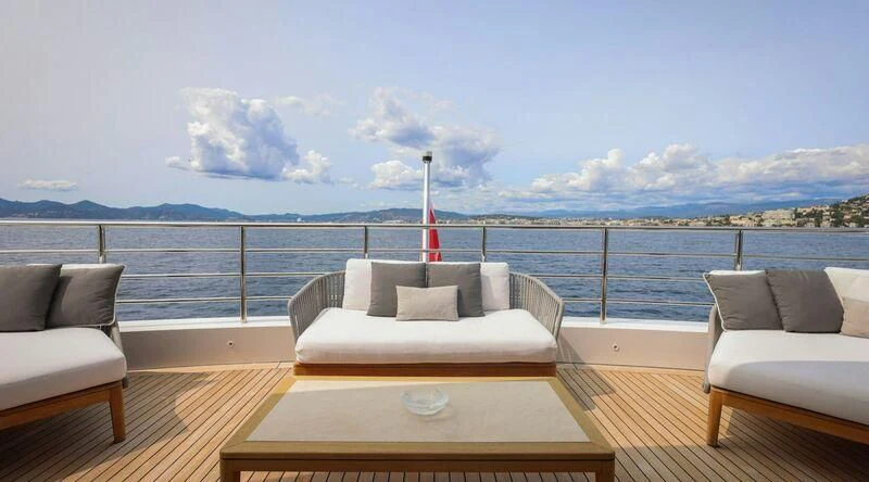a large balcony overlooking a body of water aboard MEDIALLY Yacht for Sale