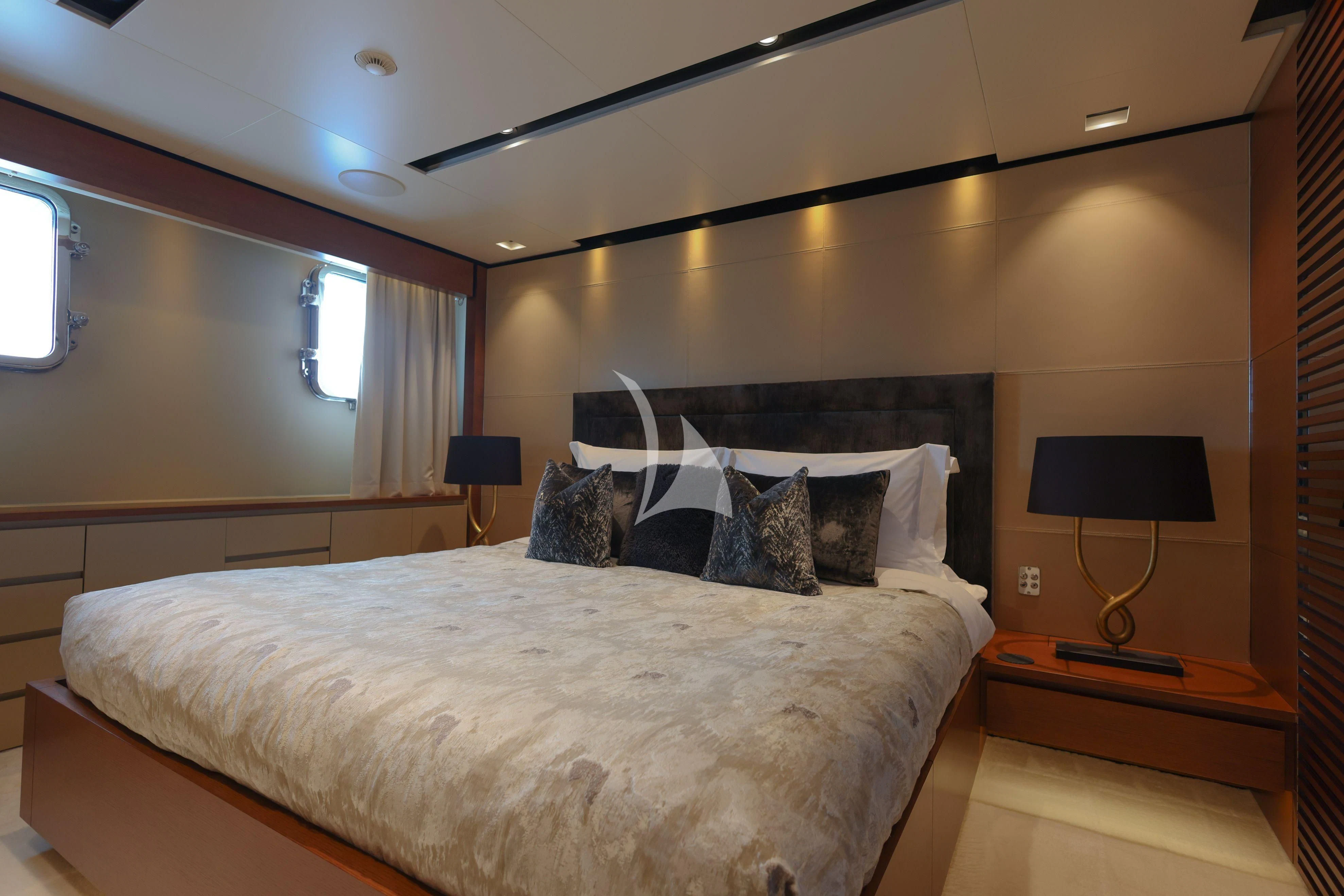a bed with pillows on it aboard MEDIALLY Yacht for Sale