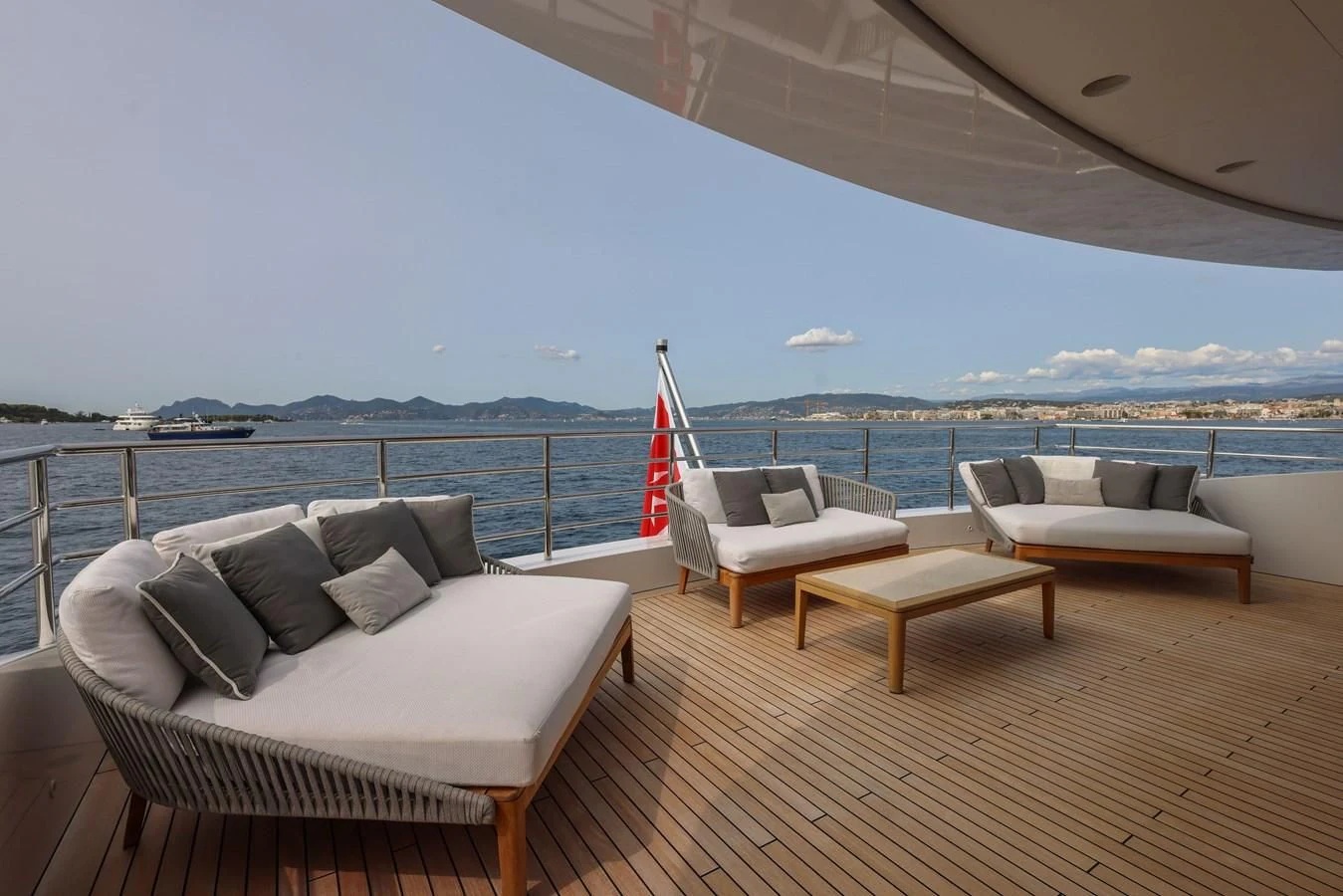 a large balcony overlooking a body of water aboard MEDIALLY Yacht for Sale
