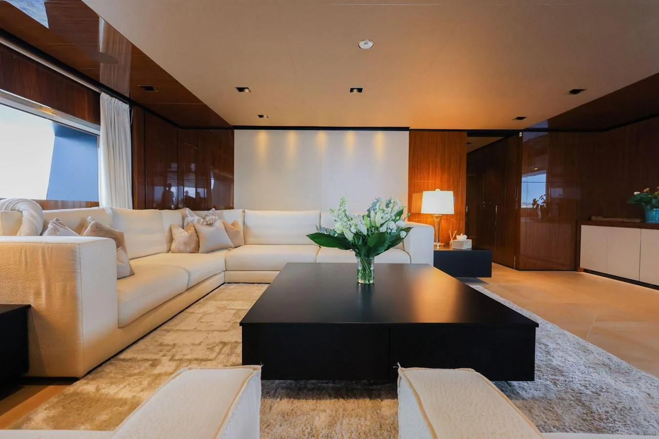 a living room with a couch and a coffee table aboard MEDIALLY Yacht for Sale
