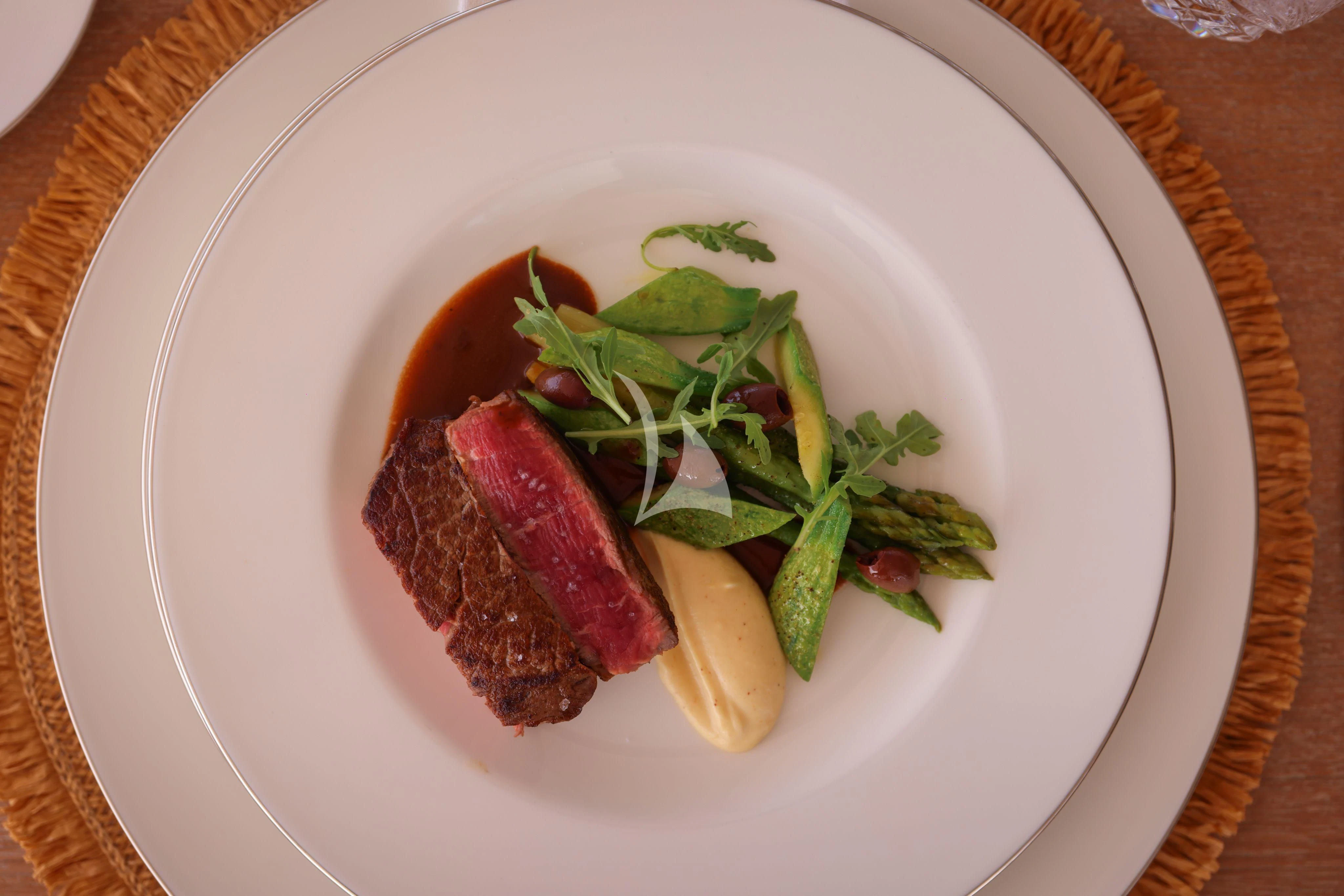 a plate of food aboard MEDIALLY Yacht for Sale
