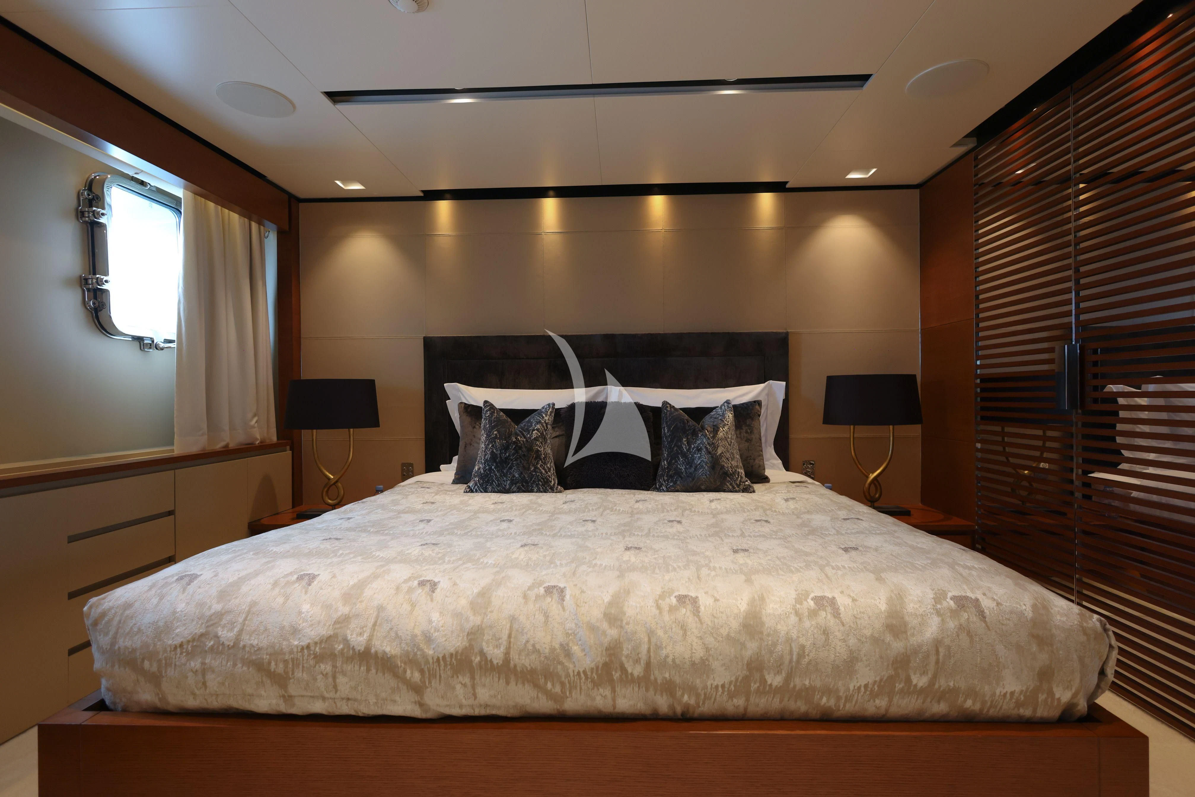 a bed with a white sheet and pillows aboard MEDIALLY Yacht for Sale