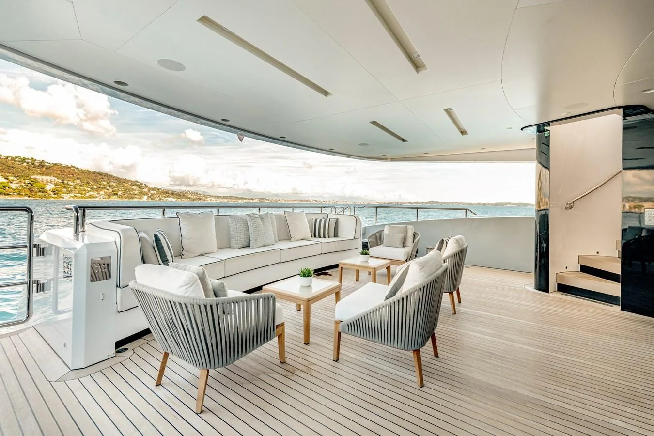 a large living room with a large patio and a large body of water aboard MEDIALLY Yacht for Sale