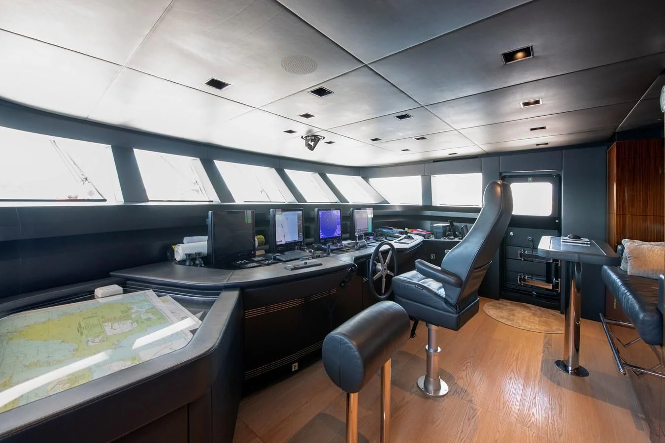 a room with computers and chairs aboard MEDIALLY Yacht for Sale