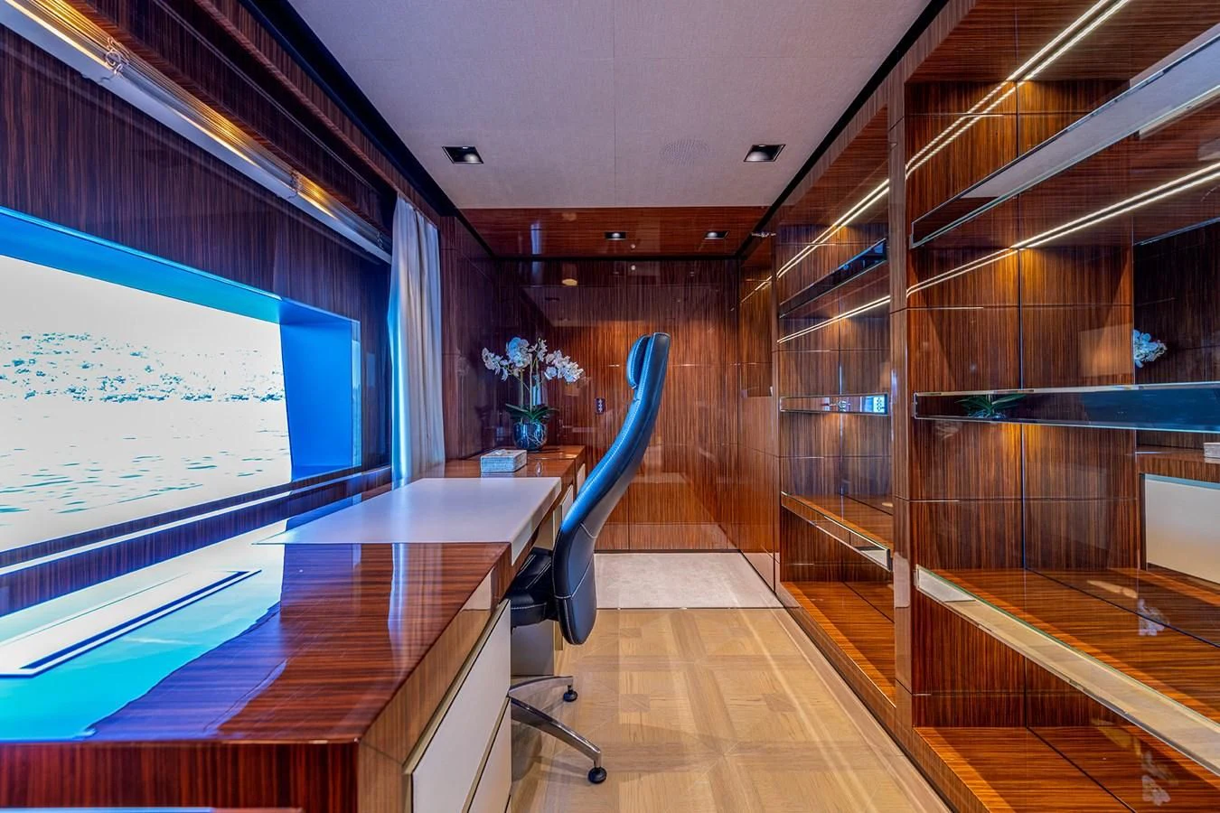 a room with a large glass wall aboard MEDIALLY Yacht for Sale