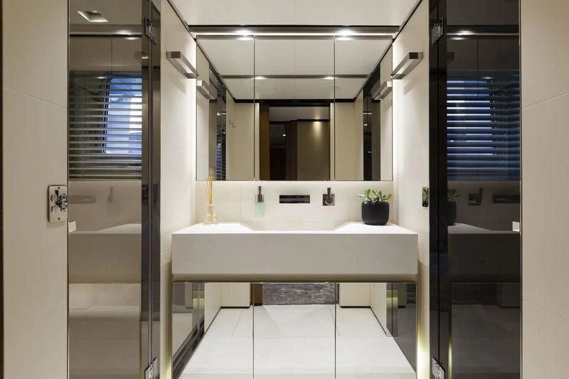 a bathroom with a large mirror aboard MEDIALLY Yacht for Sale